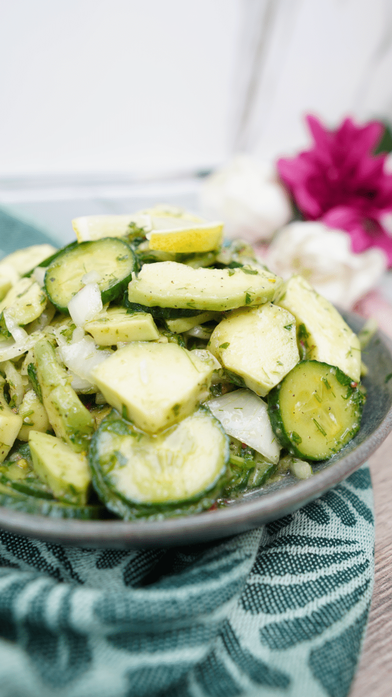 bowl of avocado cucumber salad on a table