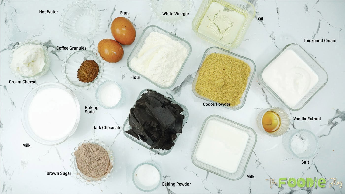 Measured ingredients for chocolate cupcakes and ganache on a light countertop