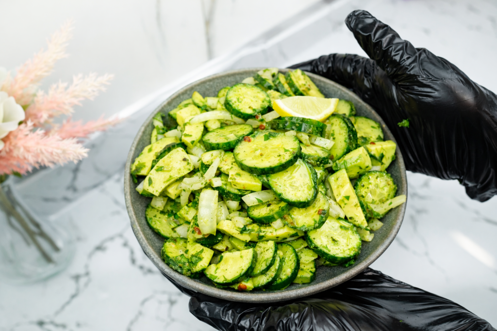 Healthy cucumber avocado salad with herbs and lemon dressing