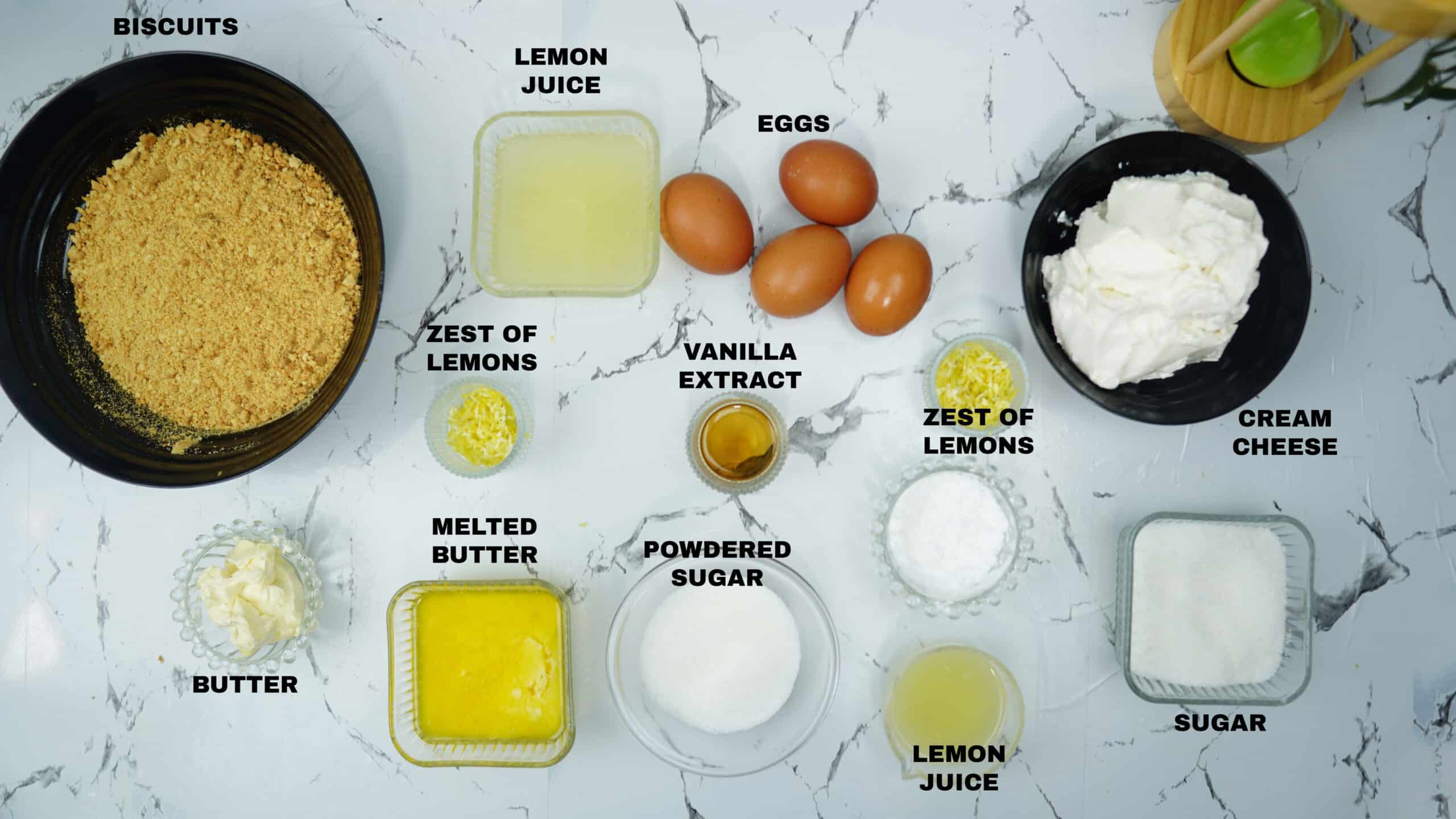Bowls of measured ingredients arranged on a countertop for recipe prep