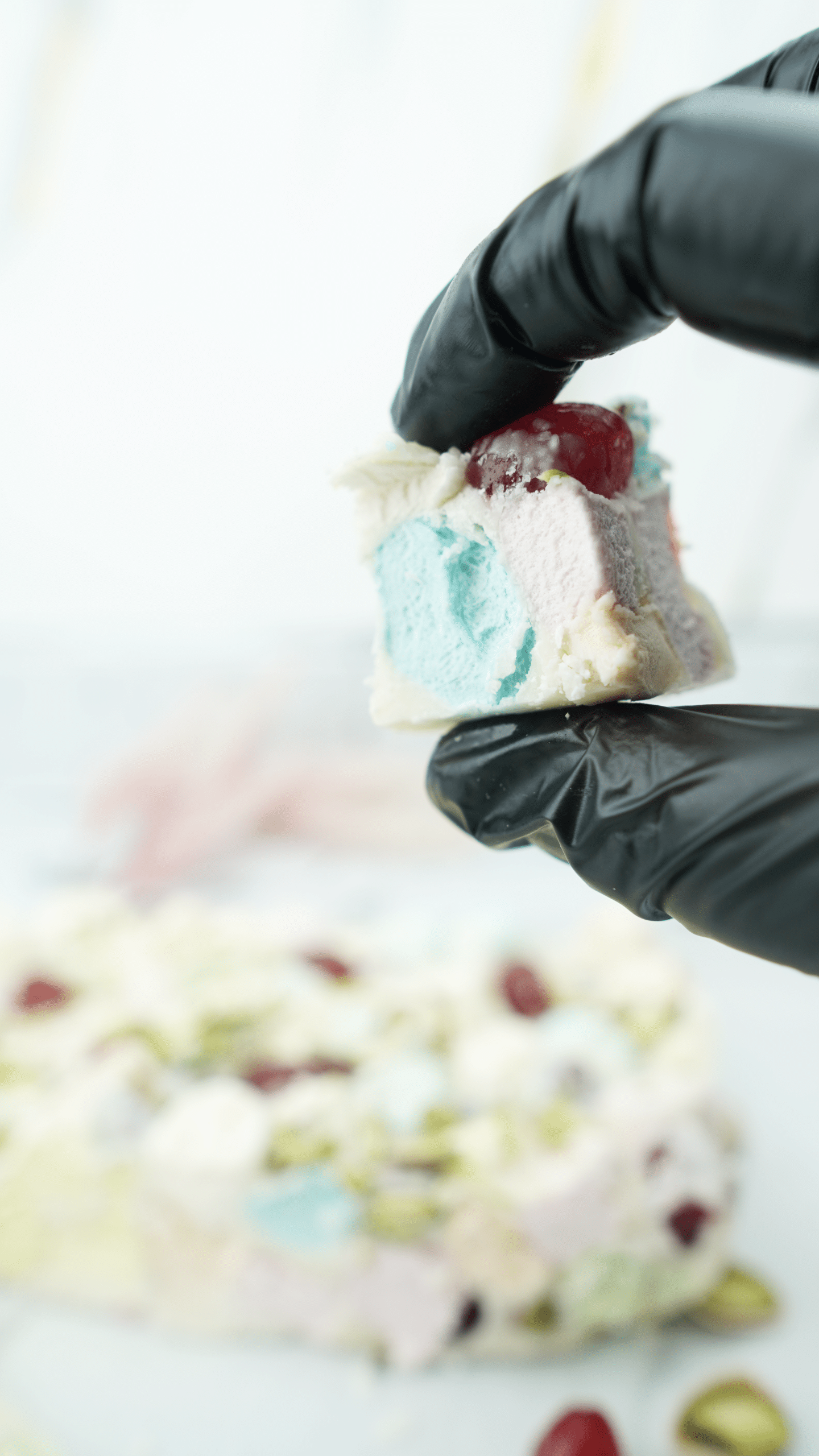 final white christmas rocky road topped with glacé cherries and pistachios