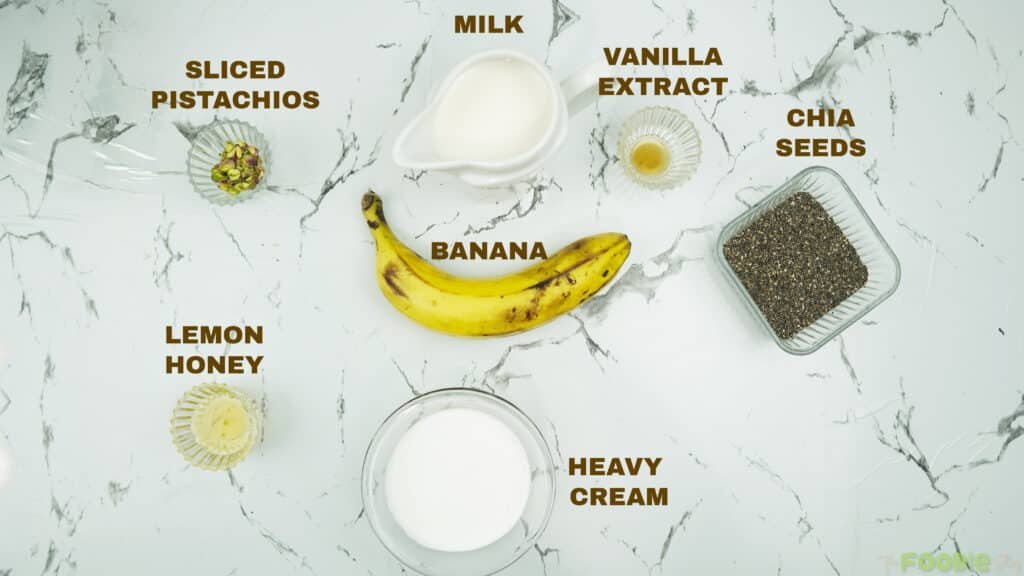 ngredients for banana chia seed pudding including banana, chia seeds, milk, heavy cream, vanilla, and pistachios