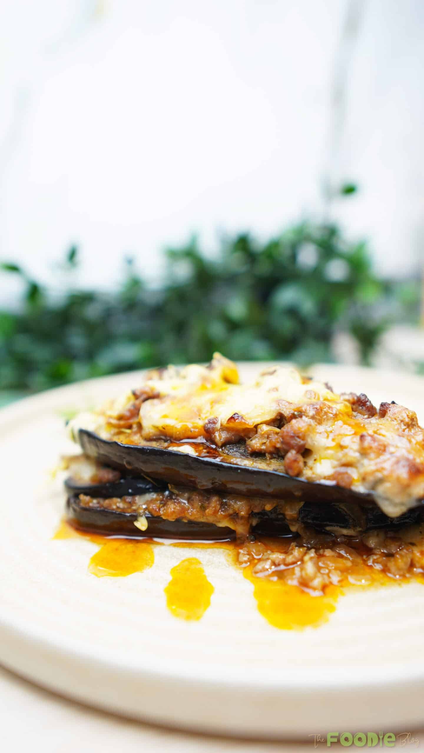 Close-up of Cheesy Beef-Stuffed Eggplant Boats with melted mozzarella and beef sauce