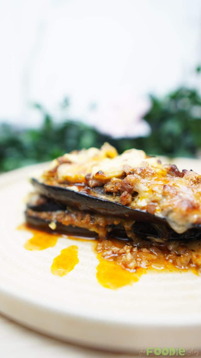 Side view of Cheesy Beef-Stuffed Eggplant Boats showing layers of eggplant, beef, and cheese