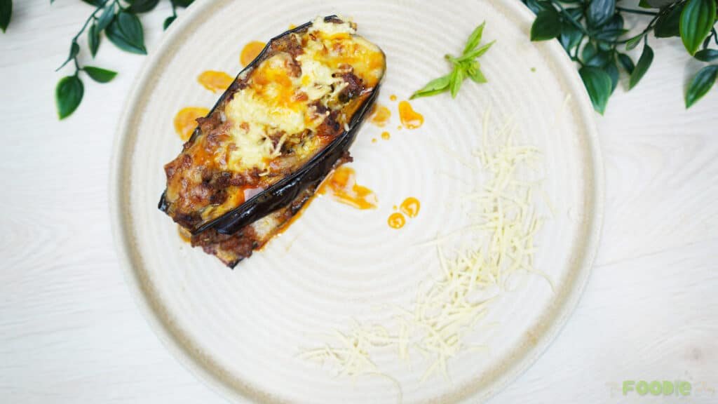 Roasted eggplant slices on a lined sheet pan for Cheesy Beef-Stuffed Eggplant Boats