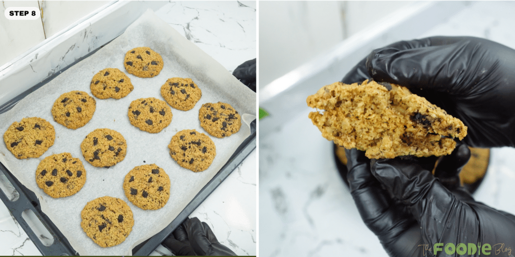 A tray of baked walnut oat cookies on parchment paper with a close-up of a broken cookie in a gloved hand.