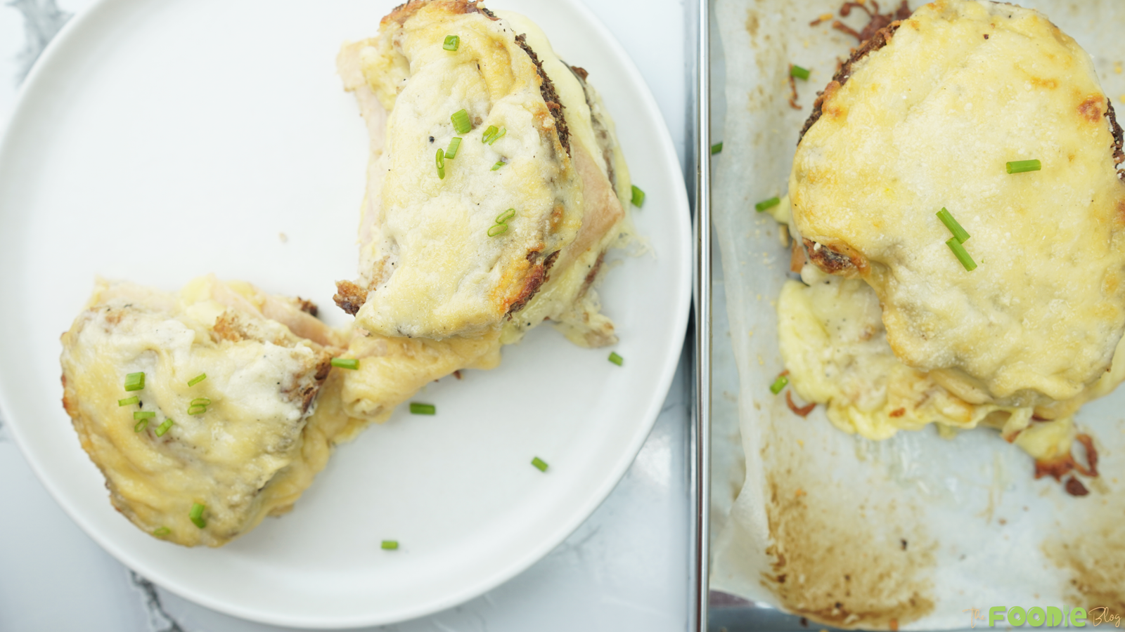 Two pieces of béchamel-topped ham and cheese sandwich on a white plate with melted cheese