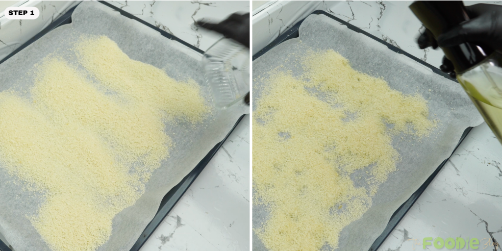 Panko breadcrumbs spread on a sheet pan and sprayed with oil before baking