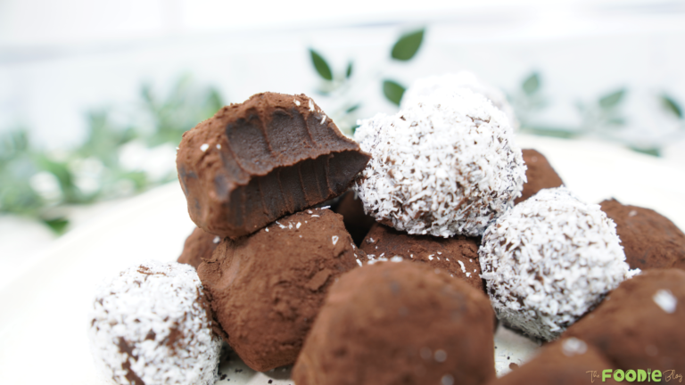 Close-up of homemade chocolate truffles with coconut coating and cocoa dusting