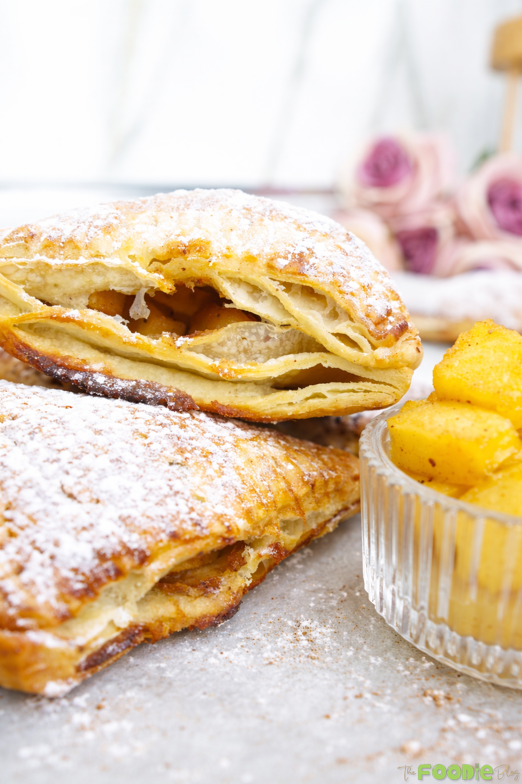 Homemade apple turnovers with cinnamon apple filling and powdered sugar