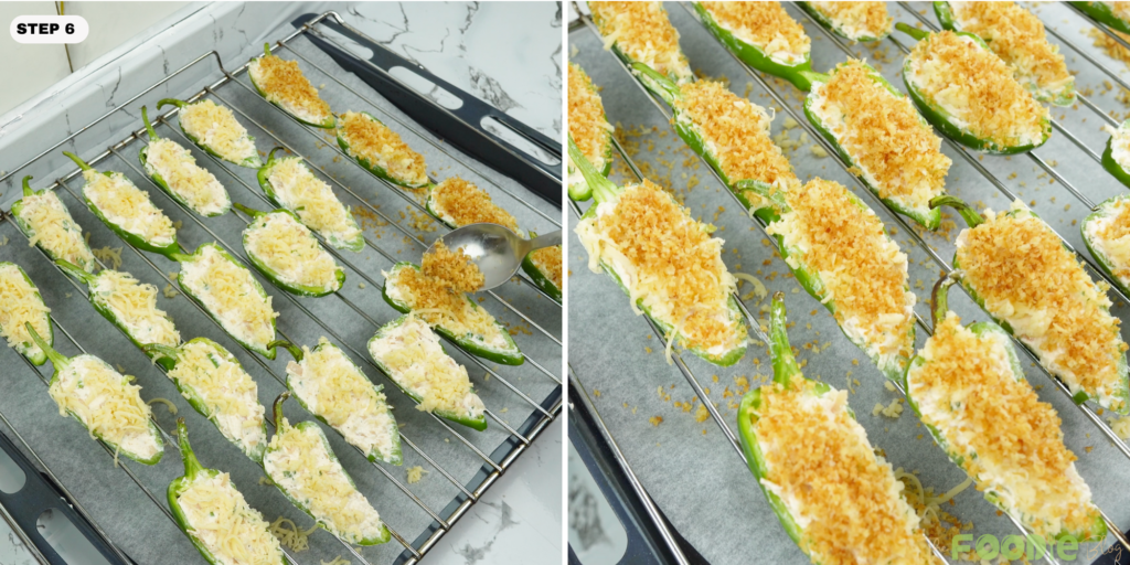 Jalapeño poppers topped with shredded cheese and toasted panko on a baking rack