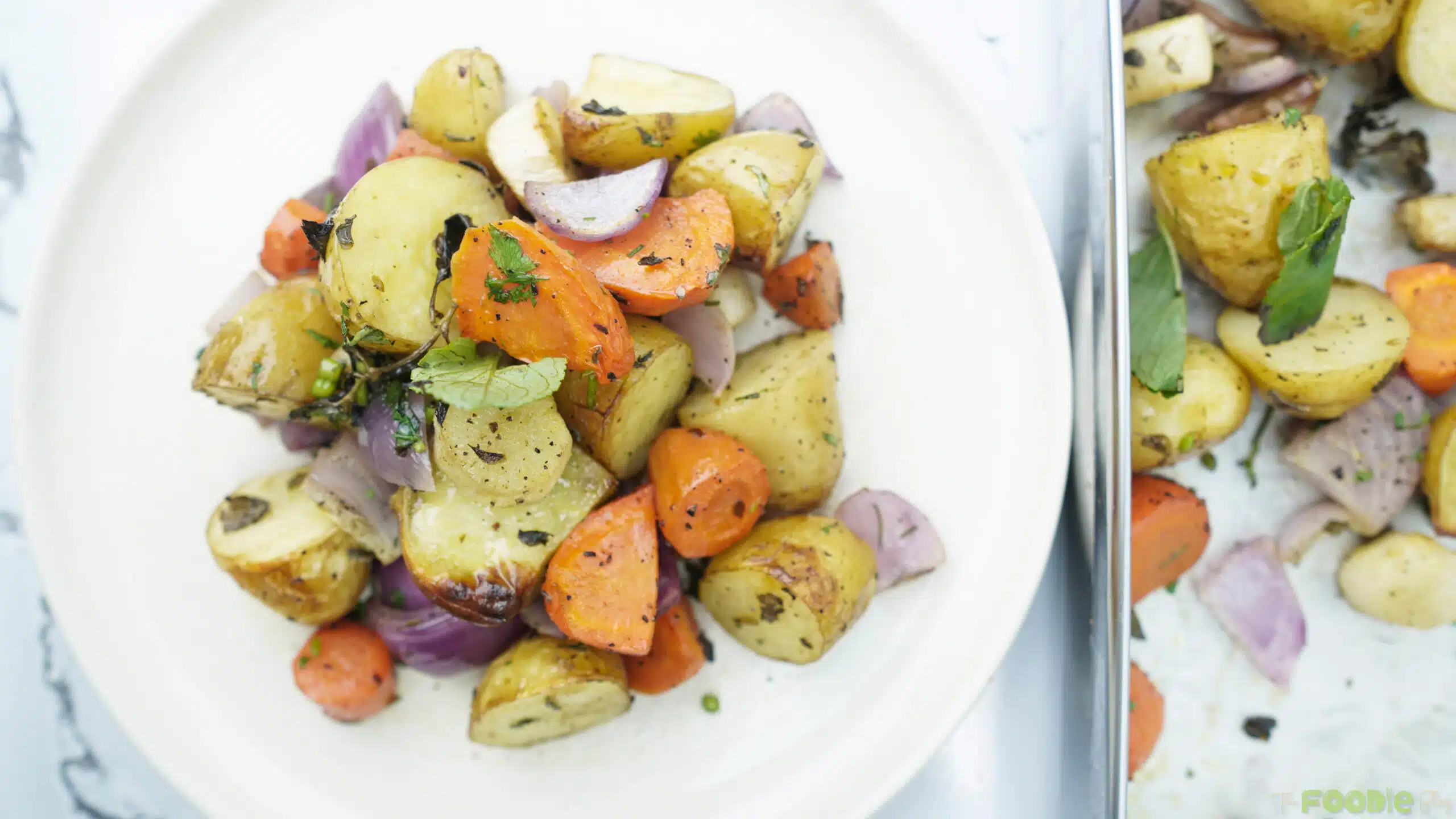 top-down view of roasted vegetables served on a white plate