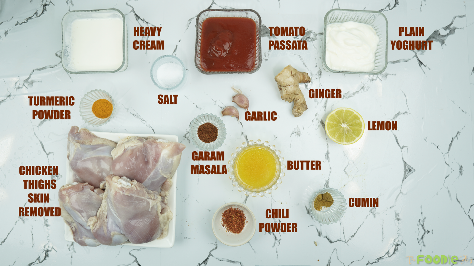 Ingredients for baked butter chicken including chicken thighs, passata, cream, yogurt, butter, and spices