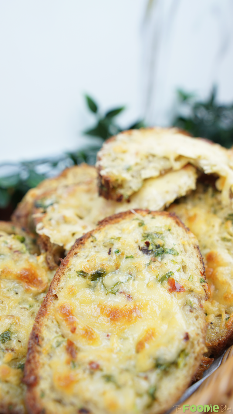 Close-up of oven baked egg toast with browned mozzarella and parsley