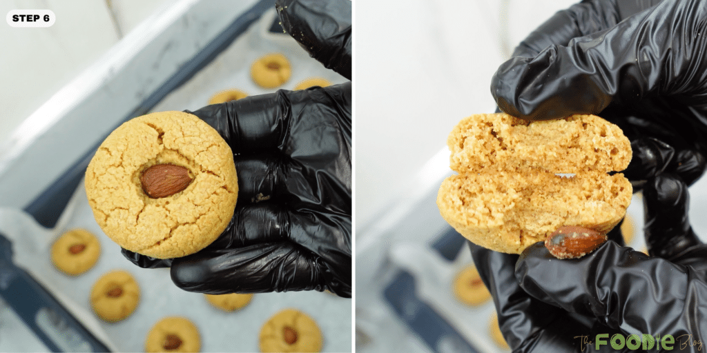 Hand holding an almond-topped cookie and a broken cookie showing the soft interior