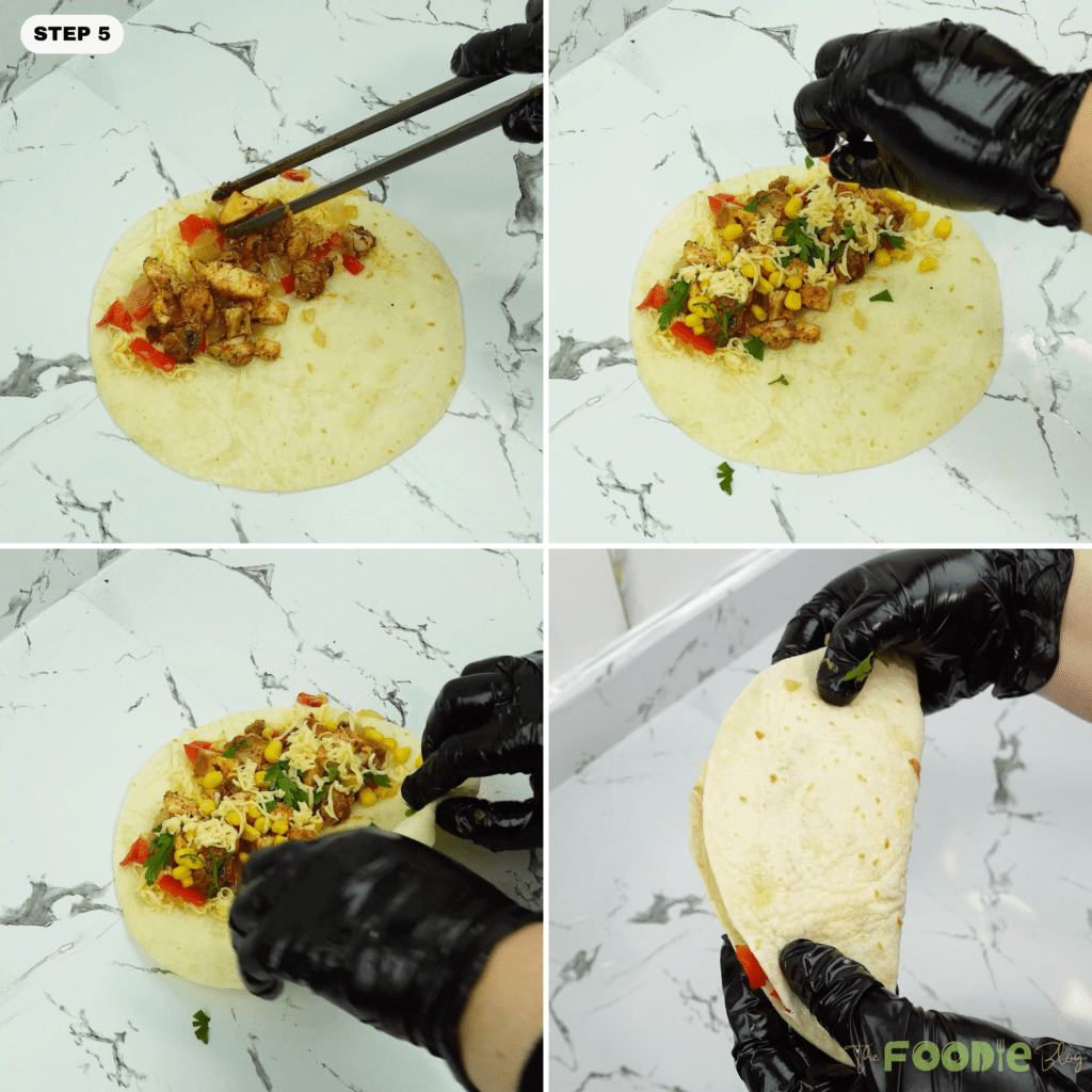 Tortilla being filled with cheese, chicken, corn, and herbs before folding