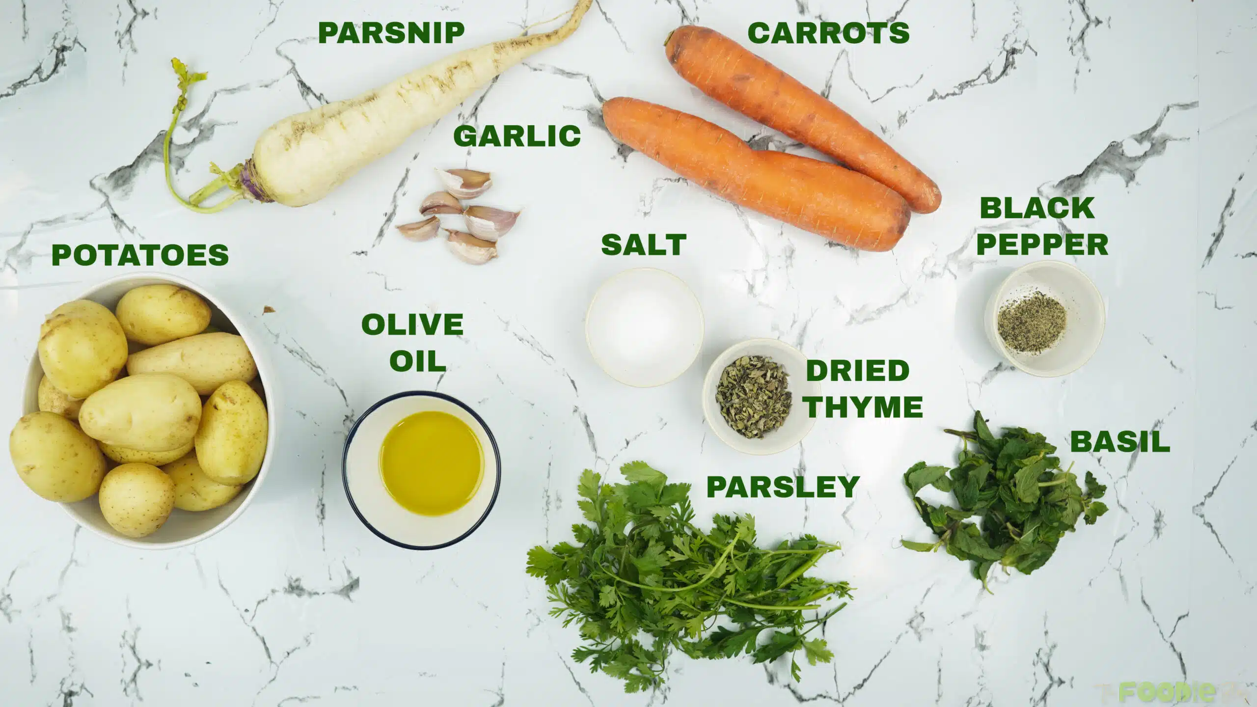 ingredients for roasted vegetables including potatoes, carrots, parsnip, garlic, olive oil, dried thyme, parsley, basil, salt, and black pepper