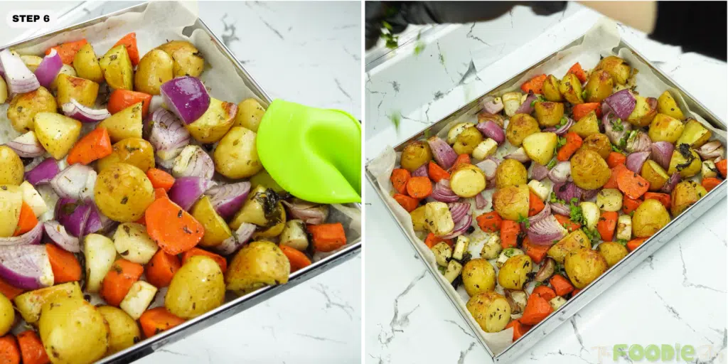roasted vegetables on a sheet pan being finished with chopped herbs