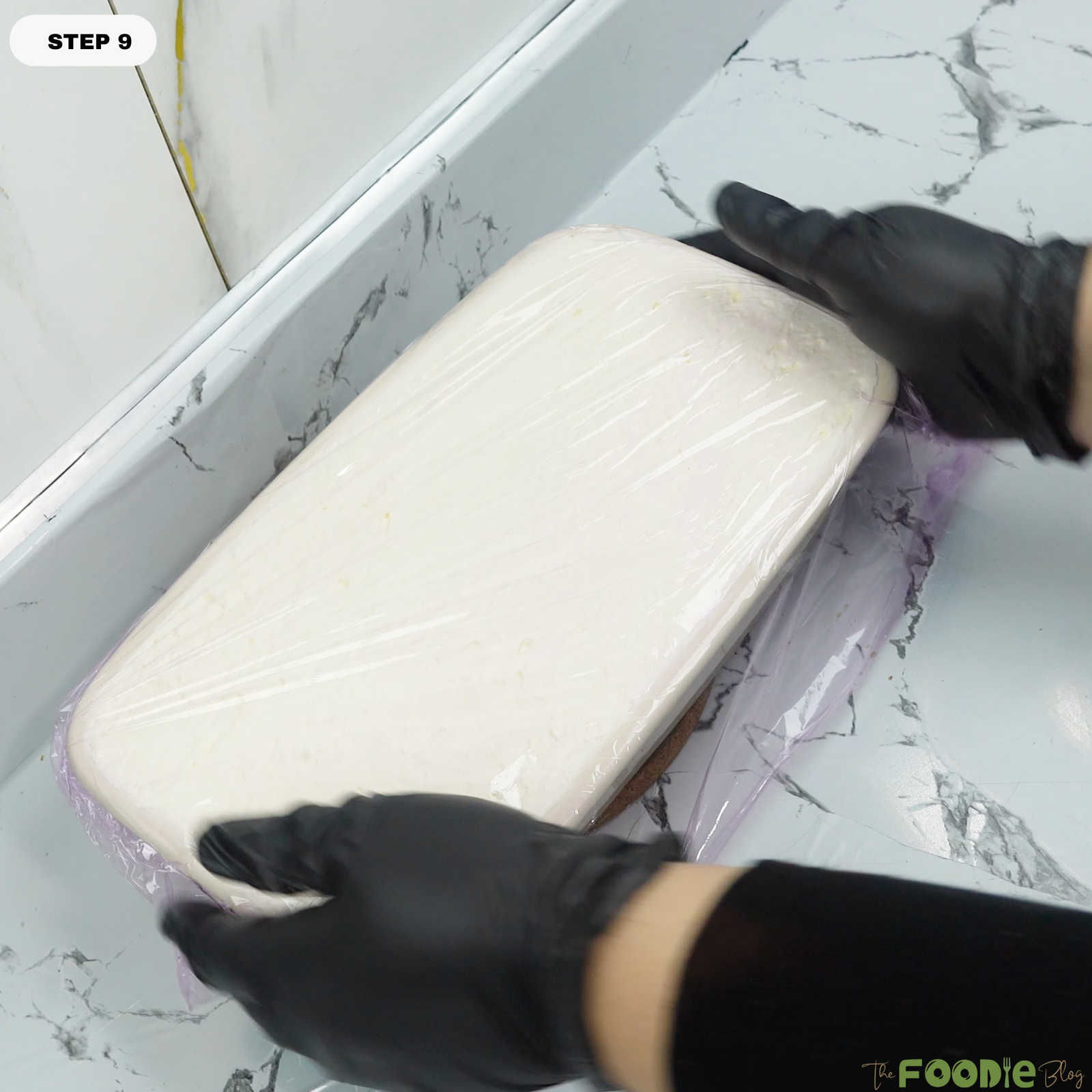 Tiramisu dish covered tightly with plastic wrap before chilling