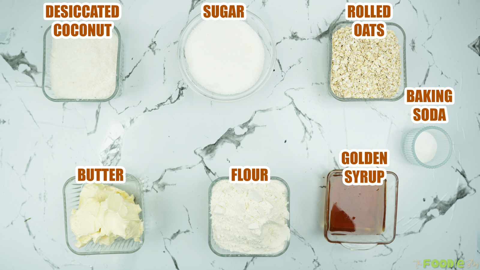 Measured ingredients including oats, coconut, flour, sugar, butter, golden syrup, and baking soda