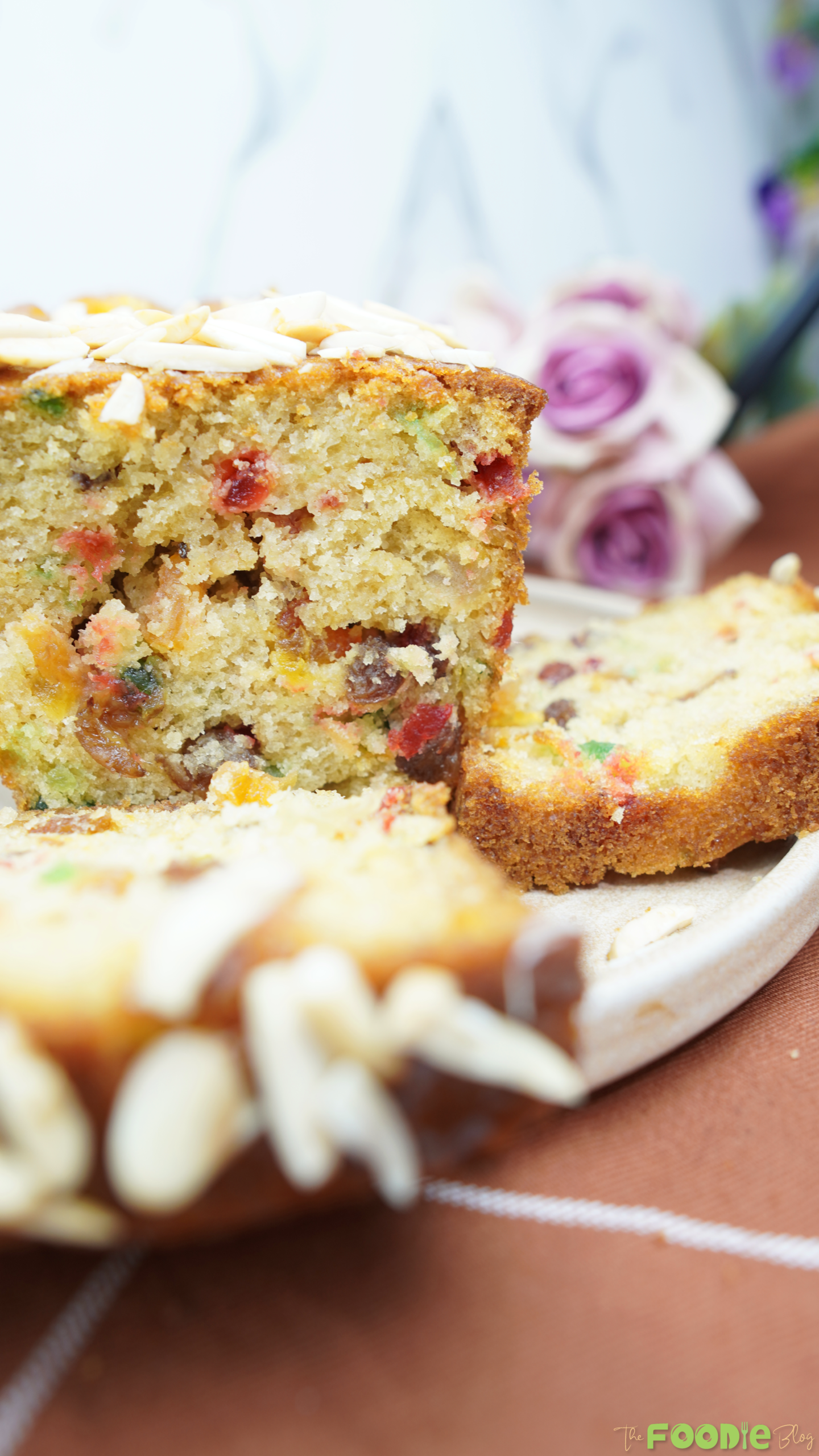 Close-up of the cake crumb packed with candied fruit and raisins