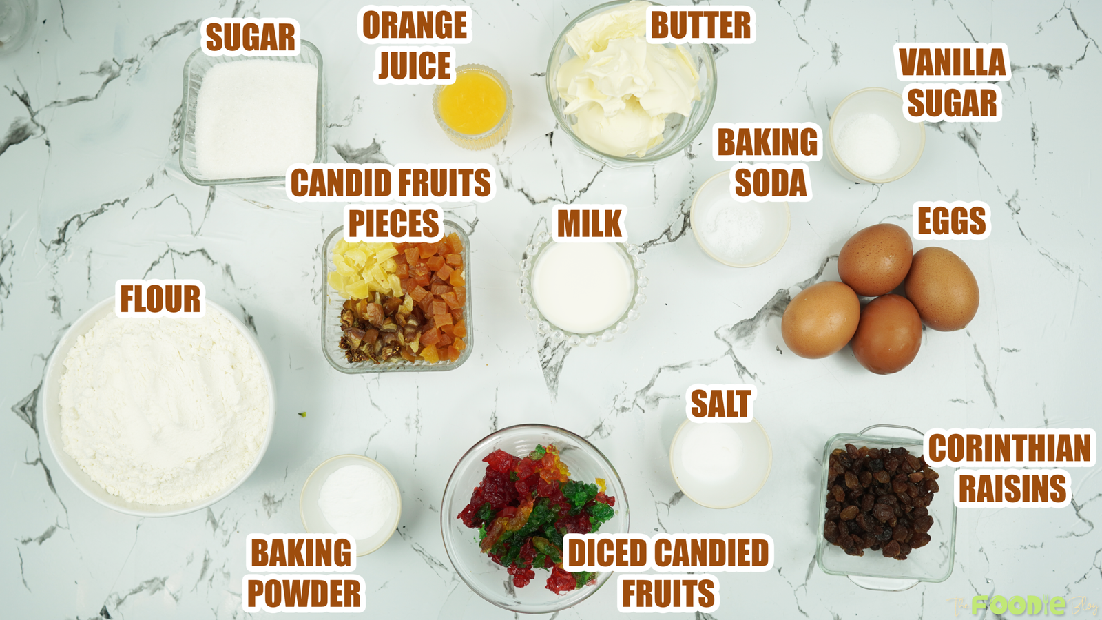 Labeled ingredients arranged on a counter for making candied fruit cake