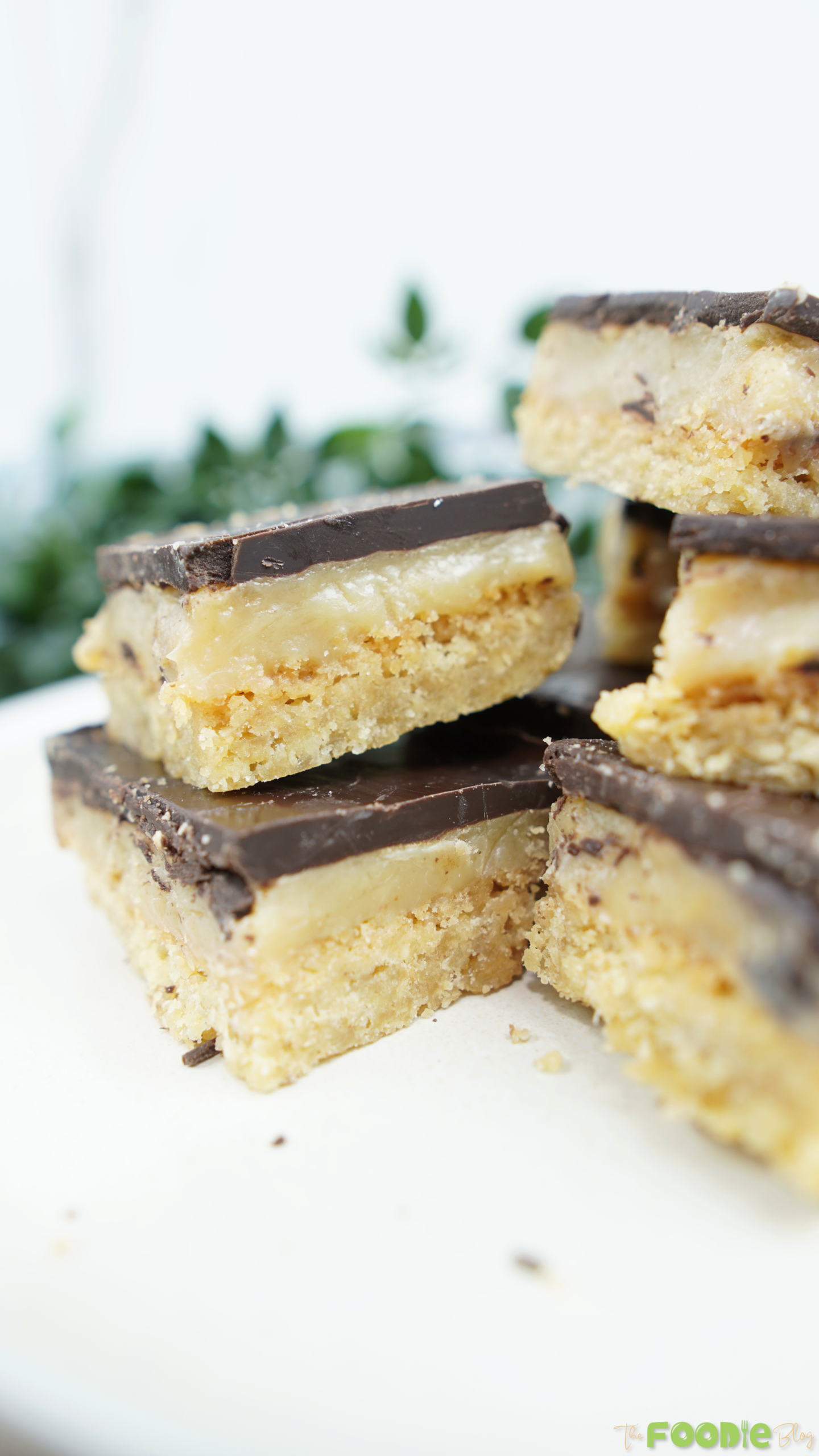 Close-up of caramel slice pieces showing thick caramel filling and chocolate topping
