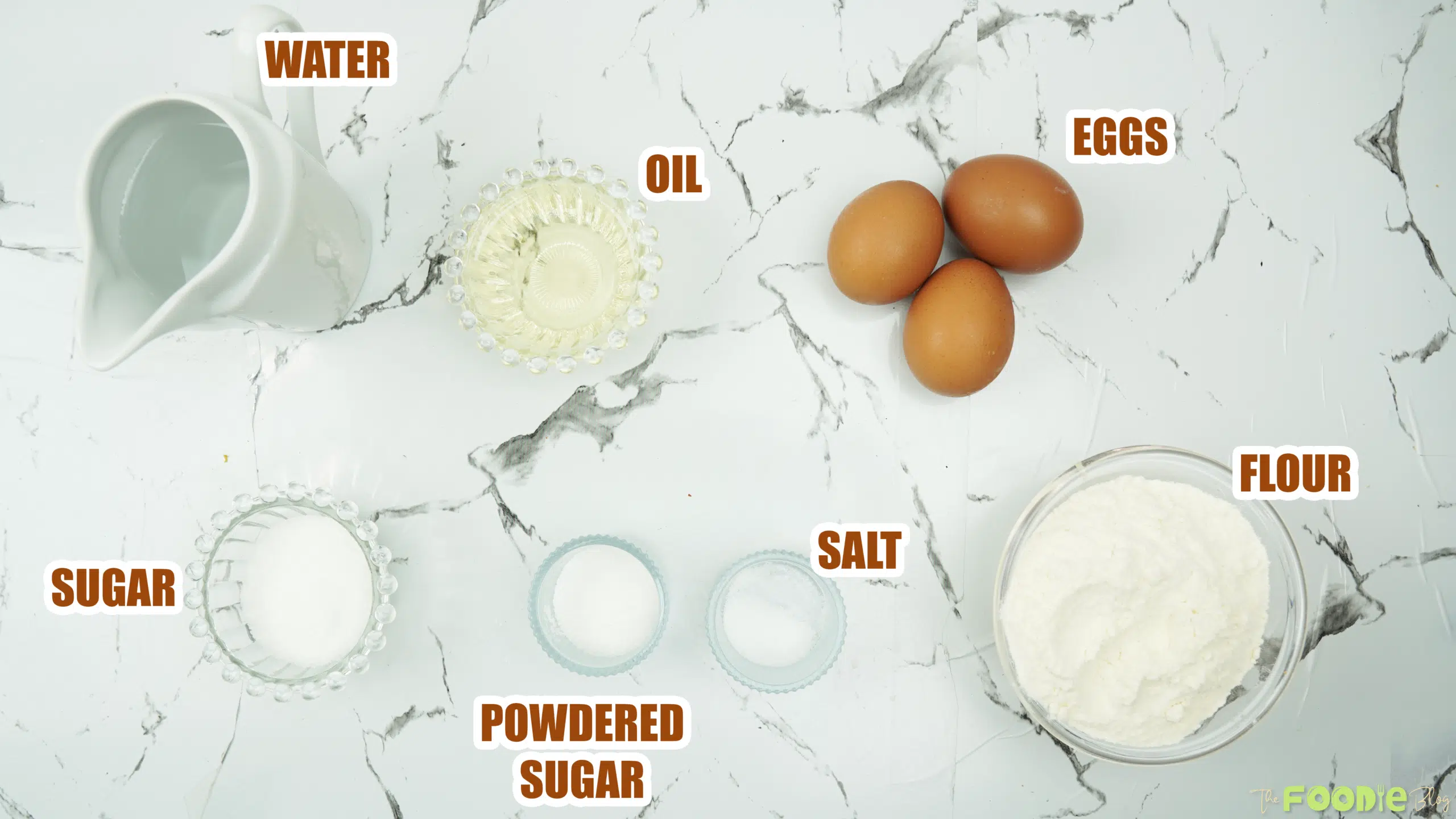 Overhead view of water, oil, eggs, sugar, salt, and flour for choux pastry