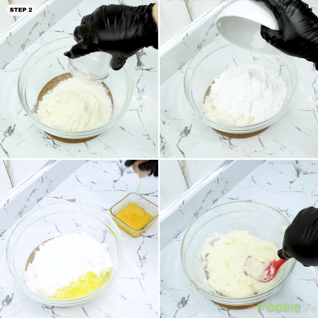 Powdered sugar and egg whites being added to coconut in a mixing bowl