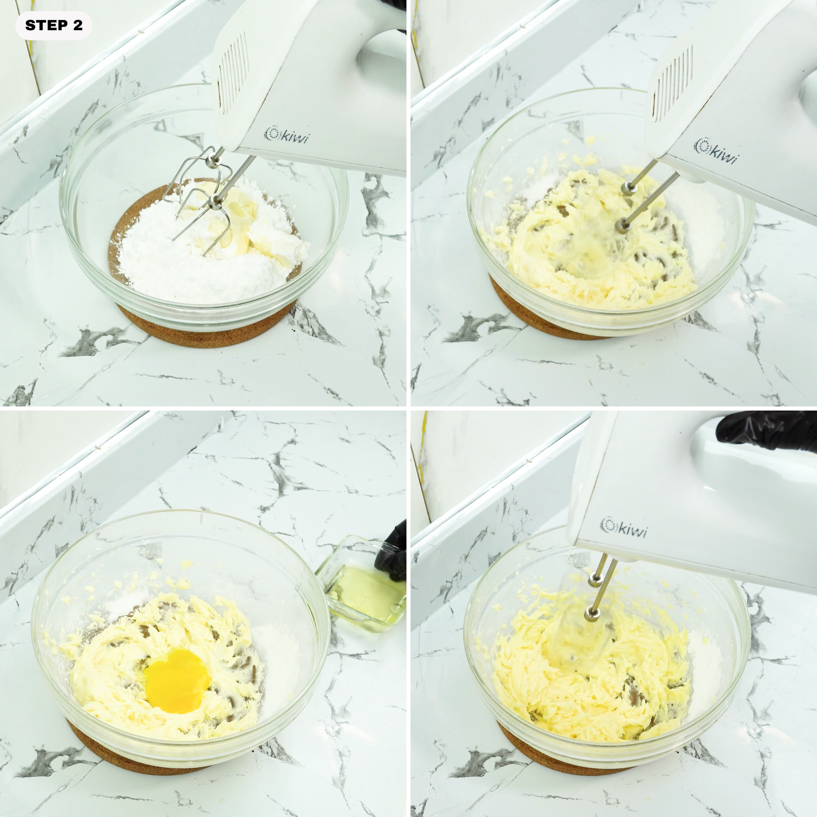 Butter and powdered sugar being mixed in a glass bowl with a hand mixer