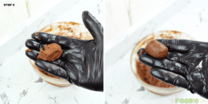 Gloved hands shaping a small oval of chocolate cookie dough