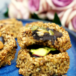 Bitten banana sesame cookie showing the chocolate-peanut butter center