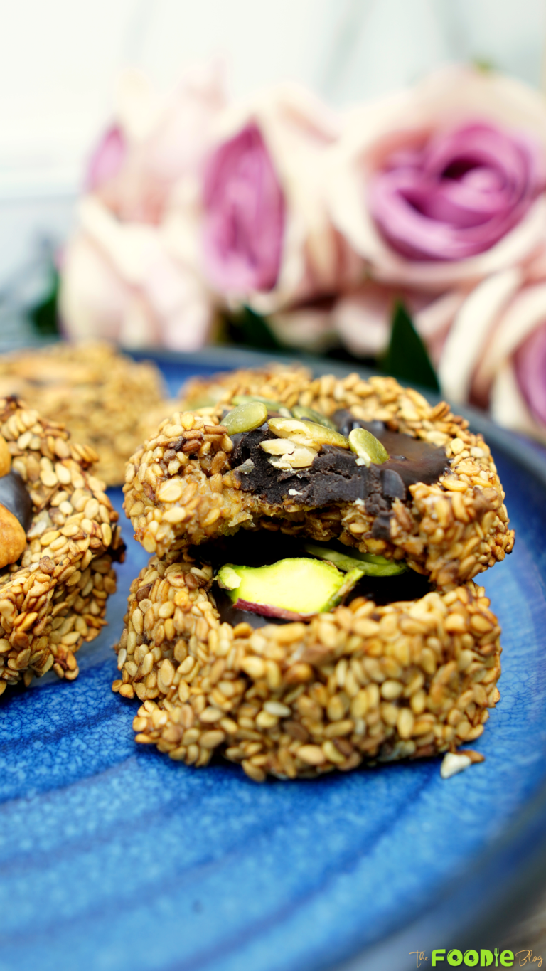 Bitten banana sesame cookie showing the chocolate-peanut butter center
