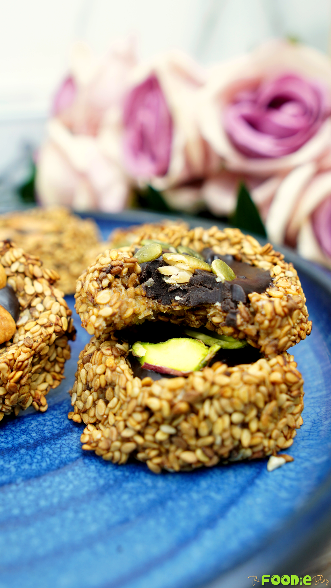 Bitten banana sesame cookie showing the chocolate-peanut butter center