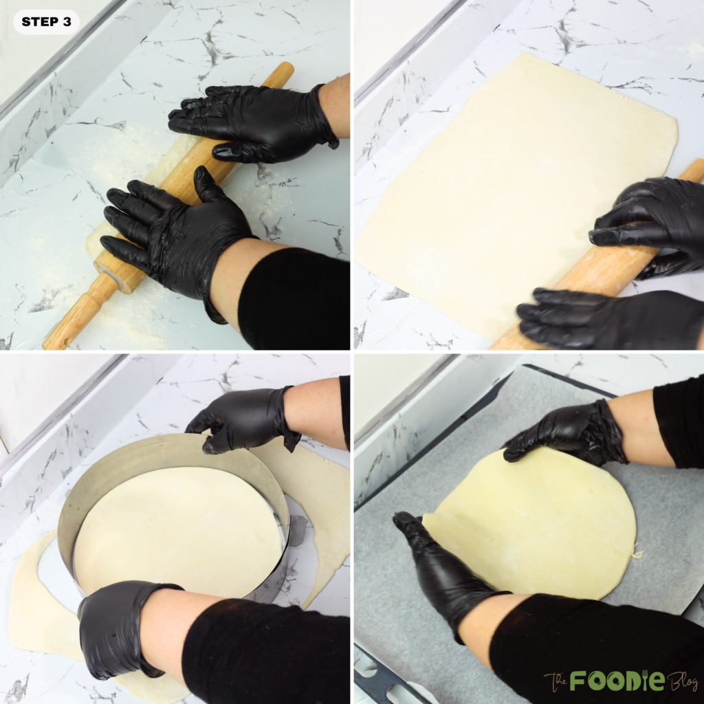 Puff pastry being rolled out and cut into a round on a floured counter