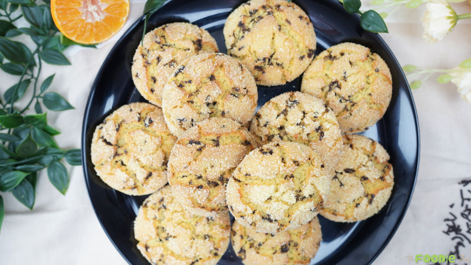 Overhead view of golden semolina cookies on a dark plate
