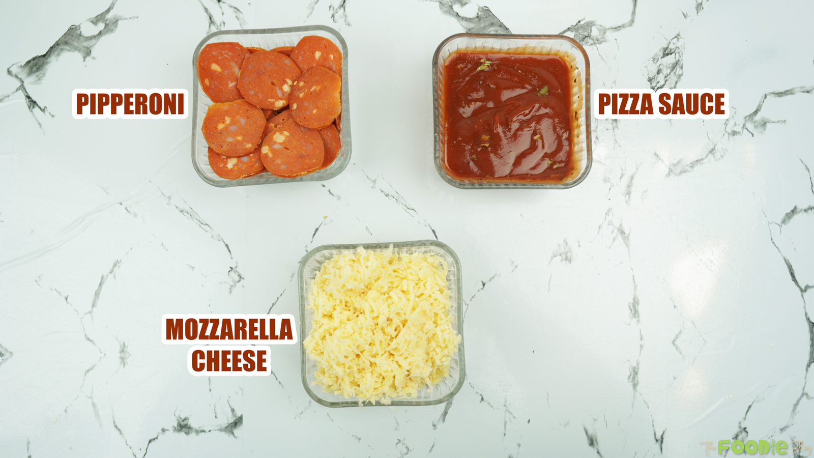 Pepperoni slices, pizza sauce, and shredded mozzarella arranged in containers