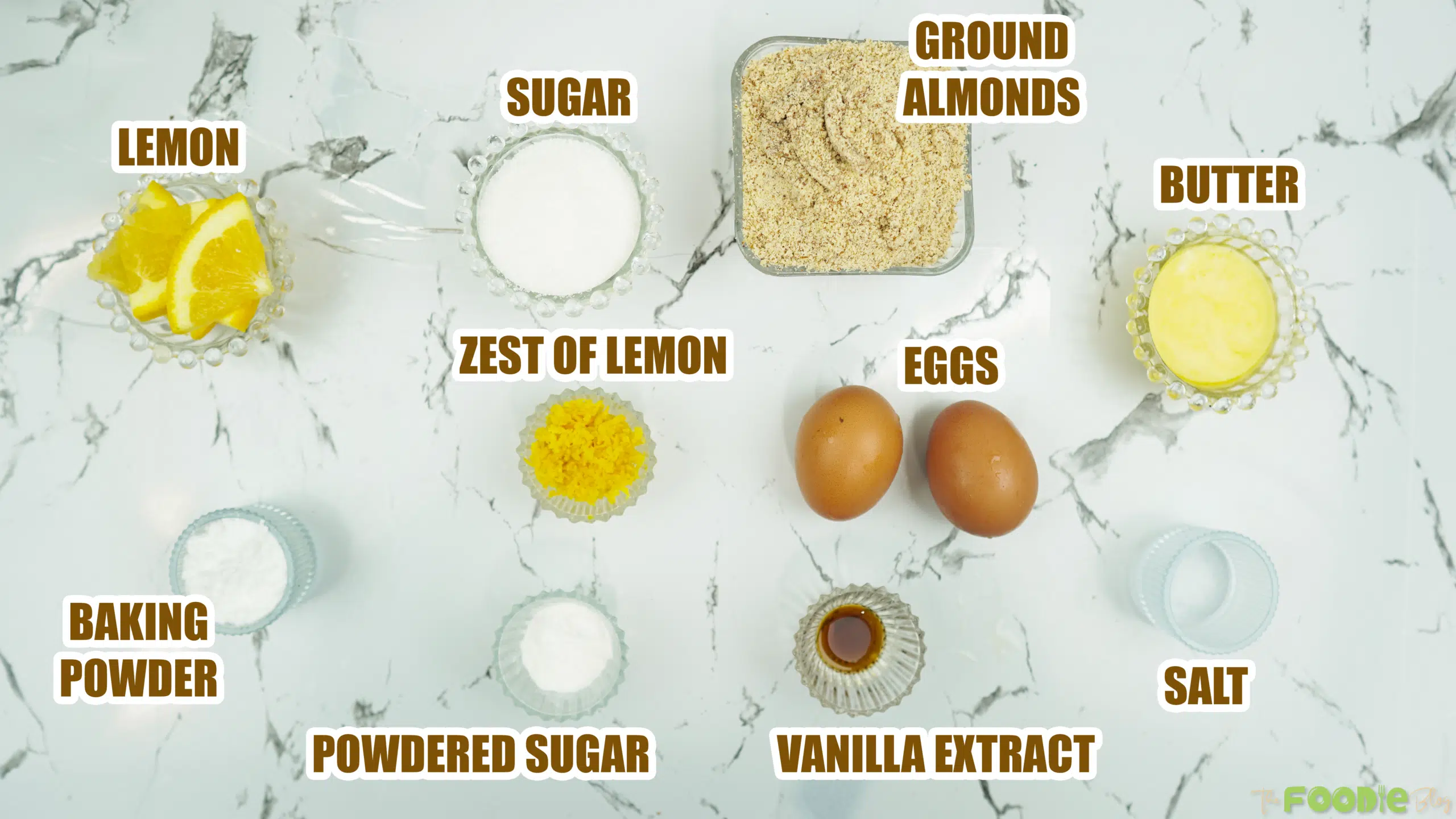 Labeled ingredients for Italian Almond Cake including ground almonds, sugar, eggs, butter, and baking powder
