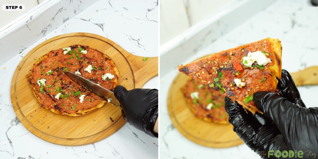 Lebanese flatbread pizza being sliced on a wooden board with a knife