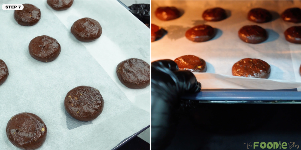 Cookie dough balls placed on a parchment-lined baking tray, ready to go into the oven.