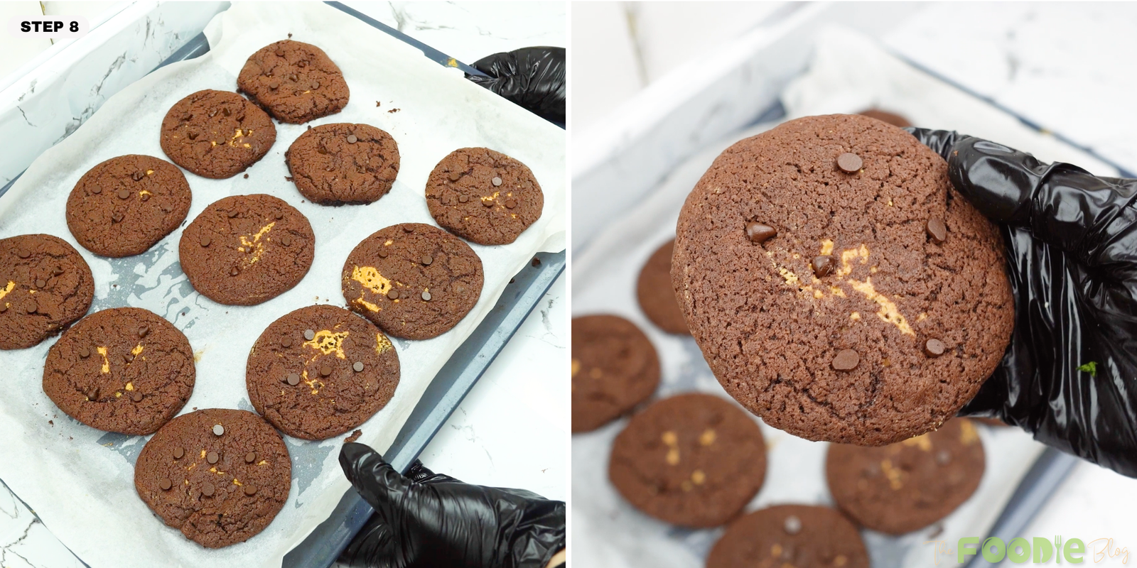 Baked chocolate peanut butter cookies on a tray with one cookie held close to the camera.