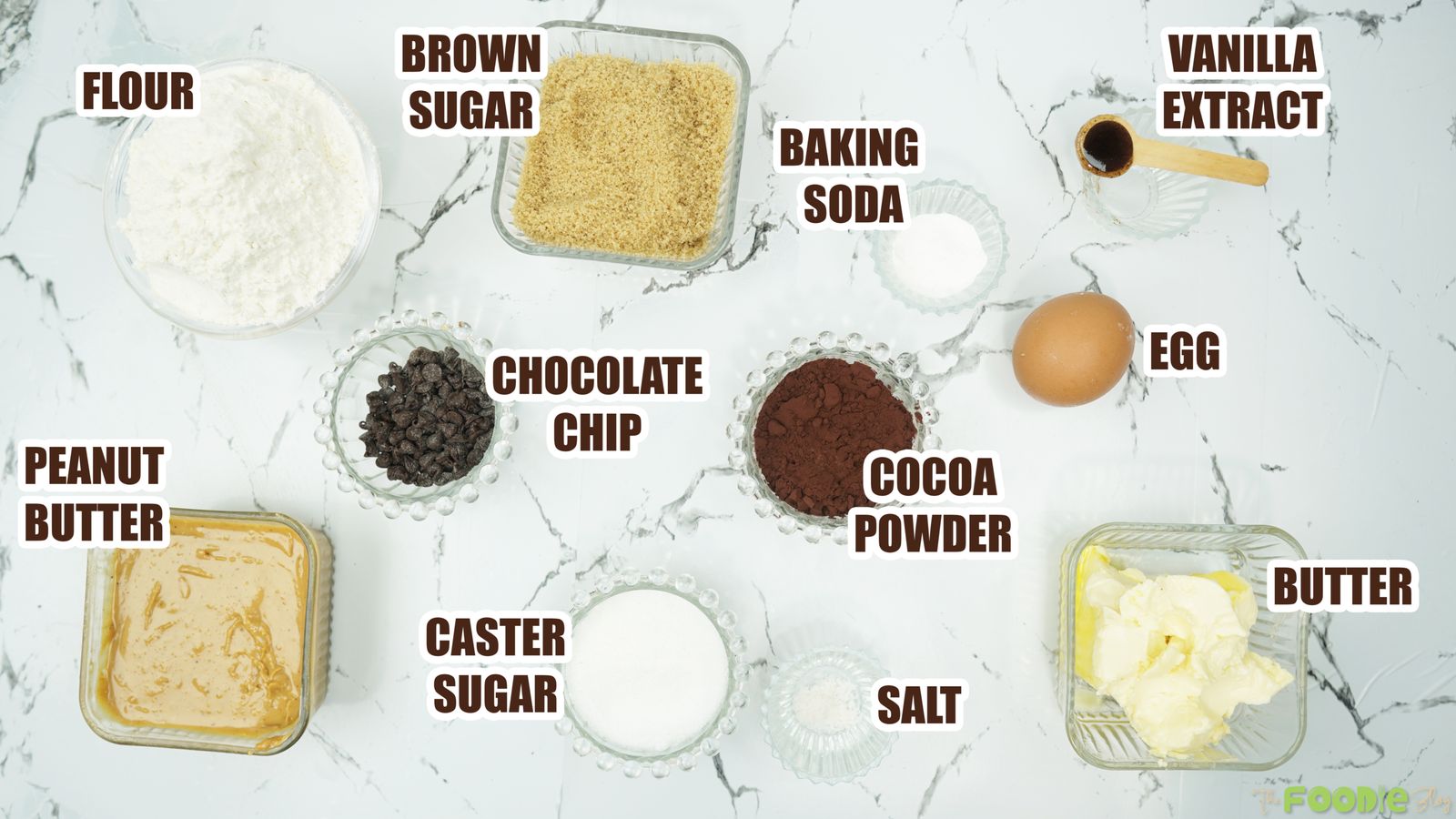 Ingredients for peanut butter cookies including flour, sugars, cocoa powder, peanut butter, butter, egg, vanilla, and chocolate chips.
