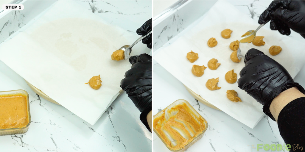 Spoon portioning peanut butter onto parchment paper for cookie centers.