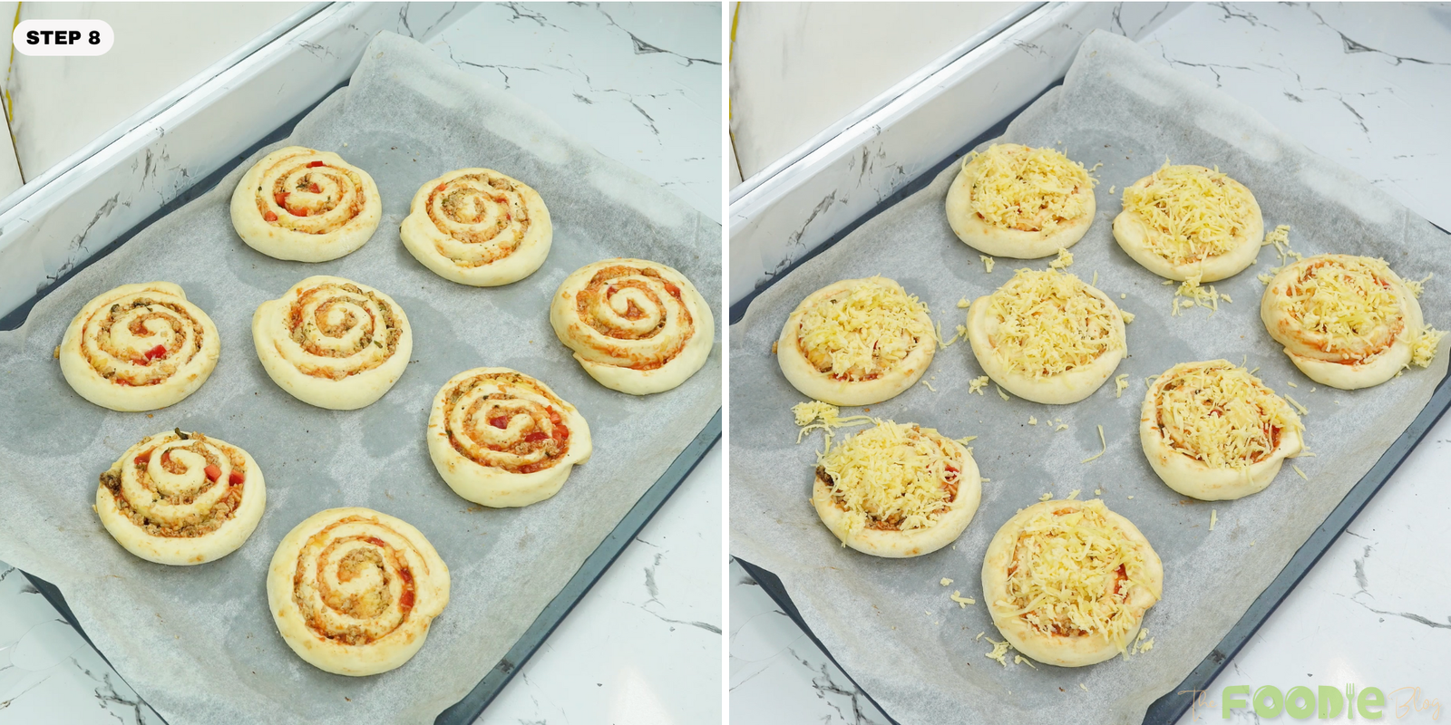 Spiral rolls on a tray topped with shredded mozzarella before baking
