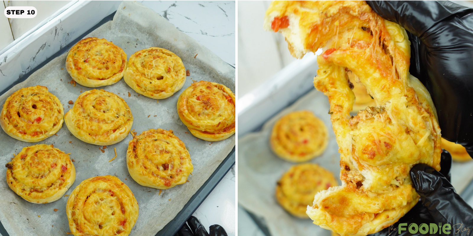 Baked pizza rolls on a tray with one roll pulled apart showing stretchy melted cheese