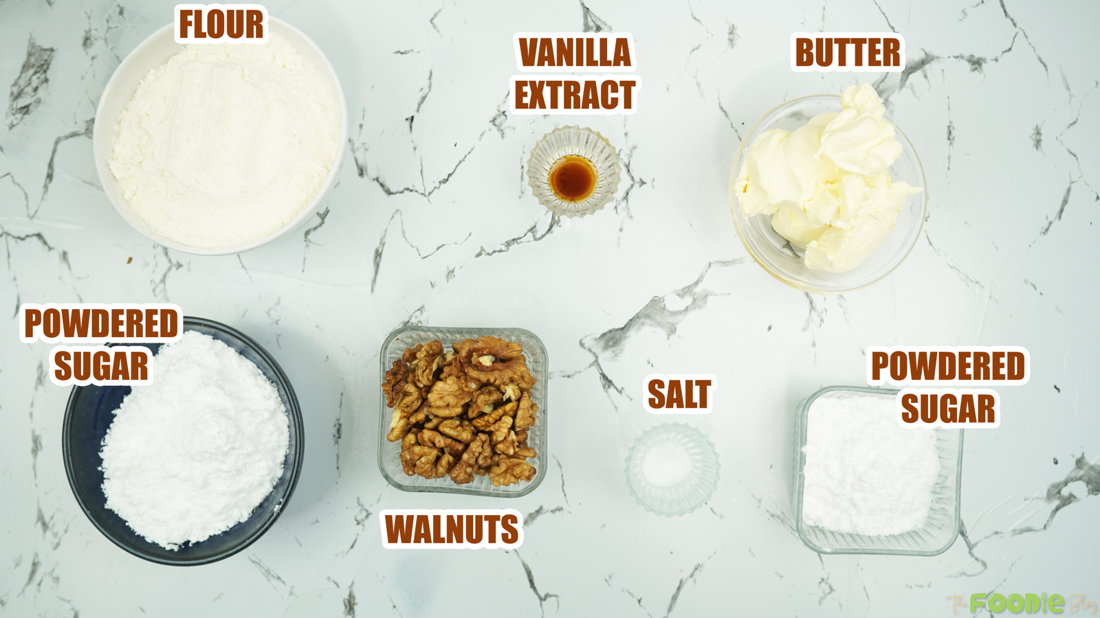 Ingredients for snowball cookies including flour, butter, powdered sugar, walnuts, vanilla, and salt