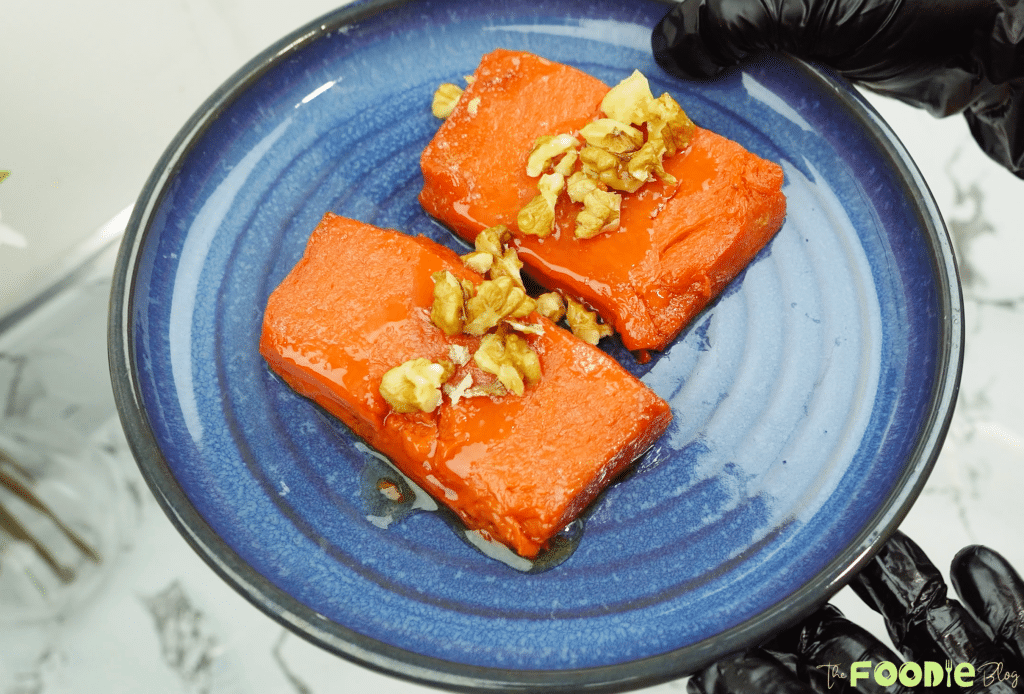 serving oven baked pumpkin dessert with walnuts
