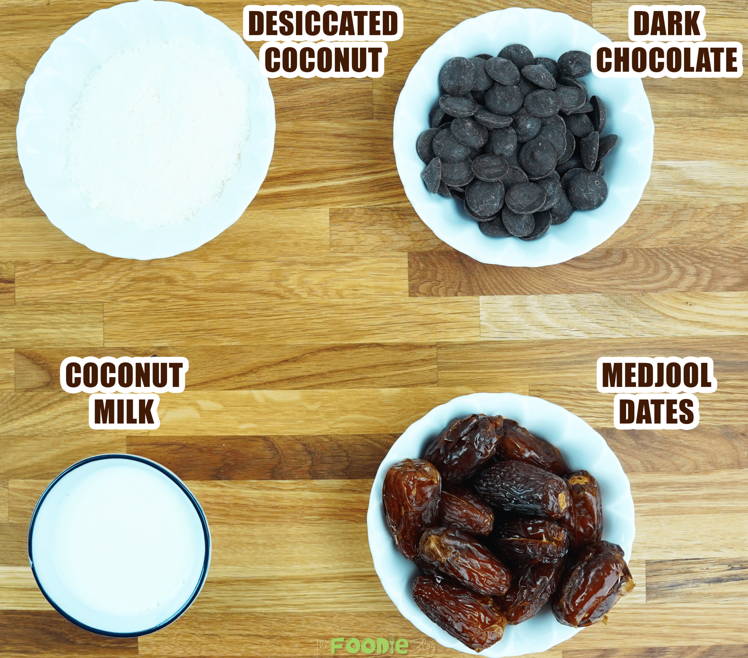 Overhead view of desiccated coconut, dark chocolate, coconut milk, and Medjool dates for Bounty Dates