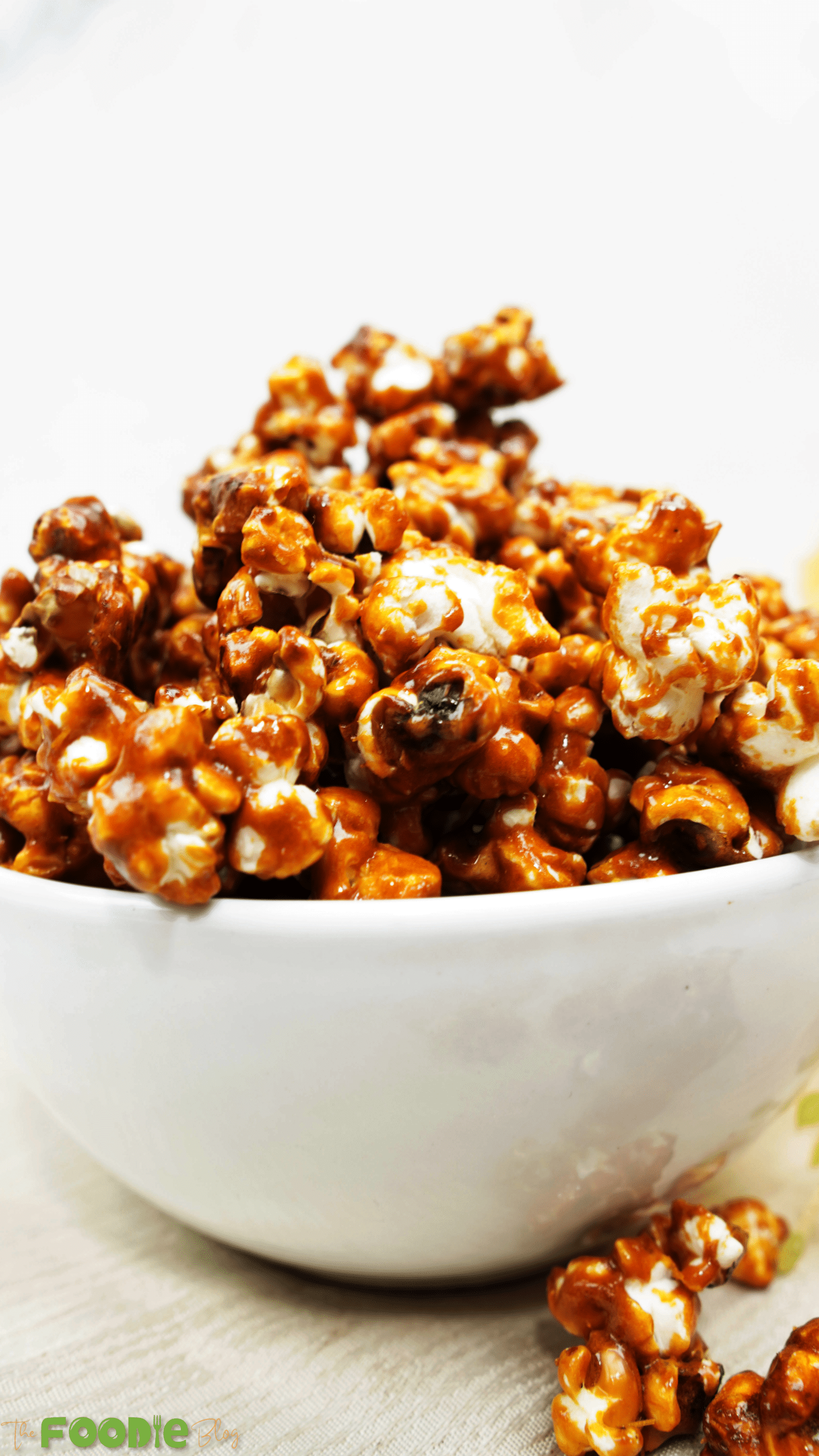 Close-up of glossy caramel-coated popcorn piled in a bowl