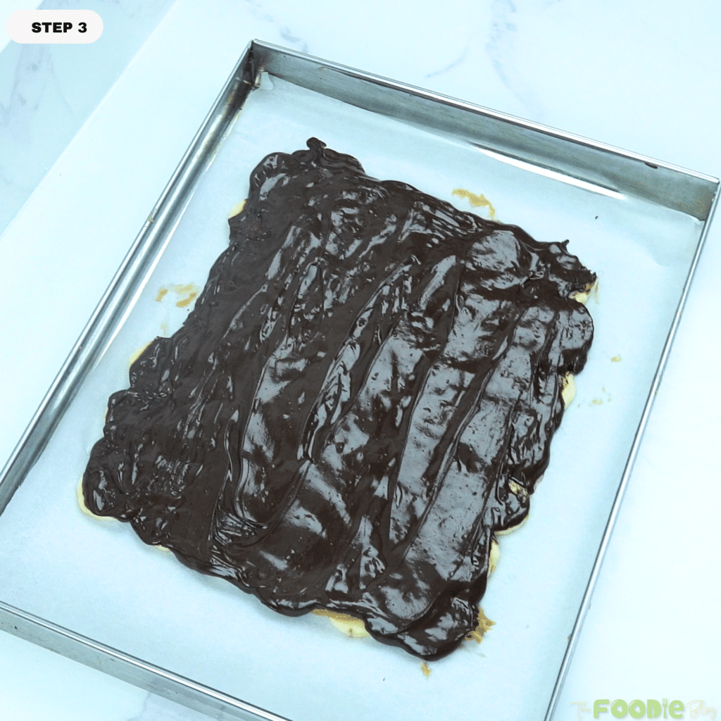 Melted dark chocolate spread over the banana and peanut butter layer